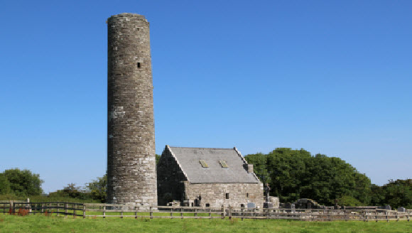 Image of round tower and old church