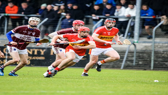 Image of men playing hurley